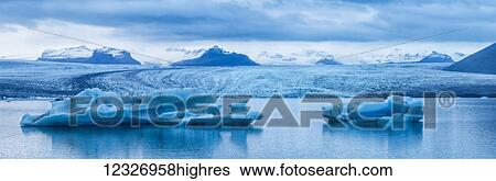 Stock Photograph - Large icebergs in Jokulsarlon, a glacial lagoon along Iceland's South coast; Iceland. Fotosearch