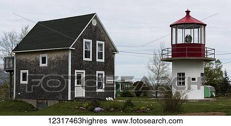 Stock Photograph - Lighthouse and building; Dingwall, 0va Scotia, Canada. Fotosearch