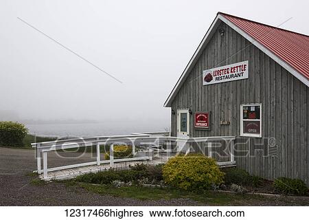 Lobster restaurant along the coast with fog settled over the water, Cape Breton Island; Louisbourg, 0va Scotia, Canada View Large Photo Image Stock Photograph - Lobster restaurant along the coast with fog settled over the water, Cape Breton Island; Louisbourg, 0va Scotia, Canada. Fotosearch