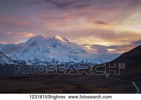 Stock Photograph - Long exposure photograph of sunset on Denali, Denali National park; Alaska, United States of America. Fotosearch