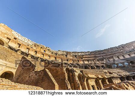 Looking up at the high walls of the Colosseum in Rome on a sunny summer day; Rome, Italy View Large Photo Image Stock Photograph - Looking up at the high walls of the Colosseum in Rome on a sunny summer day; Rome, Italy. Fotosearch