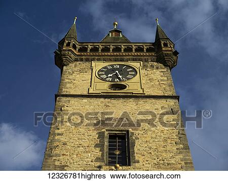 Stock Photograph - Low angle view of a clock tower in Old Town Hall, Old Town Square; Prague, Czech Republic. Fotosearch