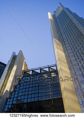 Stock Photograph - Low angle view of modern buildings and skyscrapers; Toronto, Ontario, Canada. Fotosearch