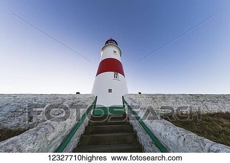 Stock Photograph - Low angle view of steps leading to a lighthouse against a blue sky; South Shields, Tyne and Wear, England. Fotosearch