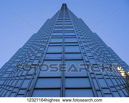 Low angle view of the facade of a skyscraper with blue facade against a blue sky; Toronto, Ontario, Canada View Large Photo Image Stock Photograph - Low angle view of the facade of a skyscraper with blue facade against a blue sky; Toronto, Ontario, Canada. Fotosearch