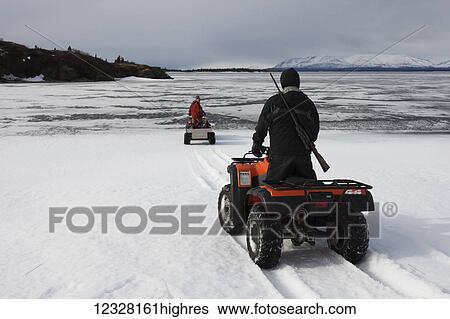 Men on a freshwater harbor seal hunt in winter, Lake Iliamna, Pedro Bay, Southcentral Alaska, USA View Large Photo Image Stock Photograph - Men on a freshwater harbor seal hunt in winter, Lake Iliamna, Pedro Bay, Southcentral Alaska, USA. Fotosearch