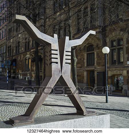 Stock Photograph - Metal sculpture in the shape of a human body; Stockholm, Sweden. Fotosearch
