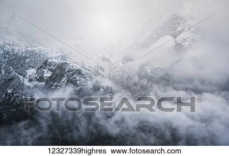 Stock Photograph - Misty mountains of Golden Ears Provincial Park; British Columbia, Canada. Fotosearch