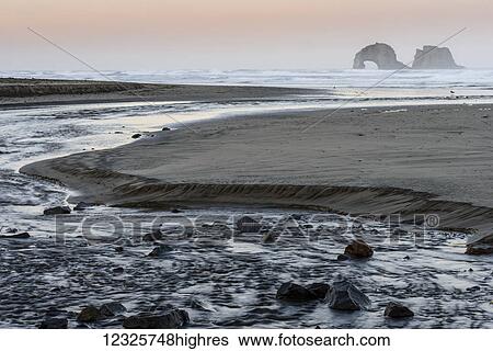 Morning comes to Rockaway Beach; Rockaway Beach, Oregon, United States of America View Large Photo Image Stock Photograph - Morning comes to Rockaway Beach; Rockaway Beach, Oregon, United States of America. Fotosearch