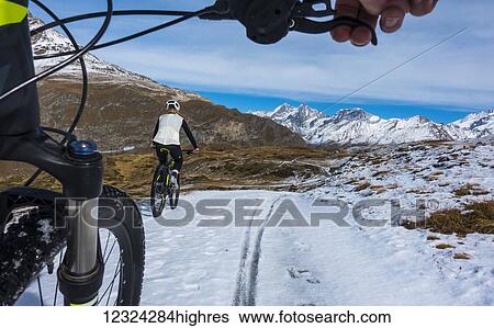 Mountain biking in the Pennine Alps, near Zermatt; Valais, Switzerland View Large Photo Image Stock Photograph - Mountain biking in the Pennine Alps, near Zermatt; Valais, Switzerland. Fotosearch