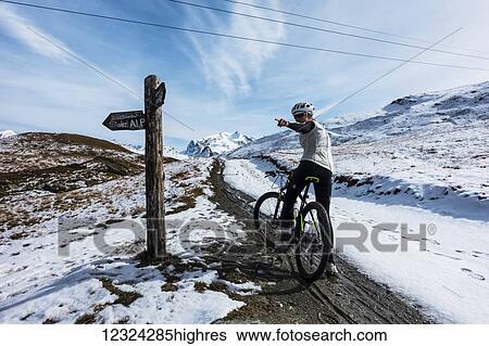 Mountain biking in the Pennine Alps, near Zermatt; Valais, Switzerland View Large Photo Image Stock Photograph - Mountain biking in the Pennine Alps, near Zermatt; Valais, Switzerland. Fotosearch