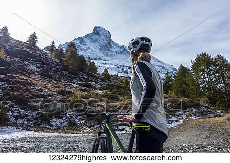 Mountain biking near Zermatt, with a view of the Matterhorn; Valais, Switzerland View Large Photo Image Stock Photograph - Mountain biking near Zermatt, with a view of the Matterhorn; Valais, Switzerland. Fotosearch