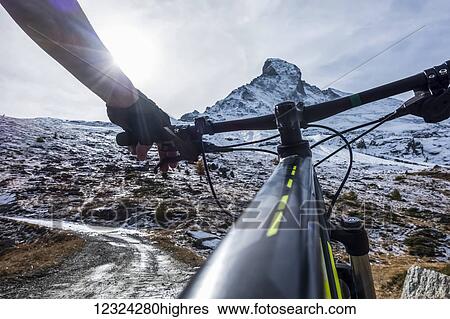 Mountain biking near Zermatt, with a view of the Matterhorn; Valais, Switzerland View Large Photo Image Stock Photograph - Mountain biking near Zermatt, with a view of the Matterhorn; Valais, Switzerland. Fotosearch