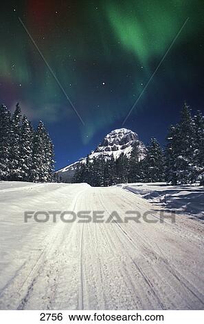 Stock Photograph - Mountains and northern lights. Fotosearch
