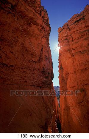 Narrow gap between two outcrops of red rock View Large Photo Image Stock Image - Narrow gap between two outcrops of red rock. Fotosearch