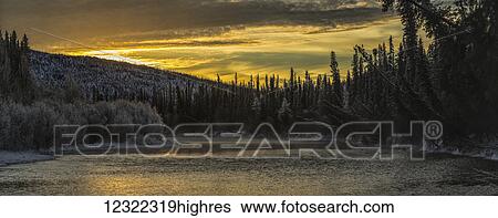 Ni'iinlii Njik (Fishing Branch) Territorial Park and Habitat Protection Area at sunrise; Yukon, Canada View Large Photo Image Stock Photograph - Ni'iinlii Njik (Fishing Branch) Territorial Park and Habitat Protection Area at sunrise; Yukon, Canada. Fotosearch