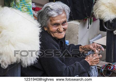 Stock Photograph - Old Georgian woman knitting; Sighnaghi, Kakheti, Georgia. Fotosearch