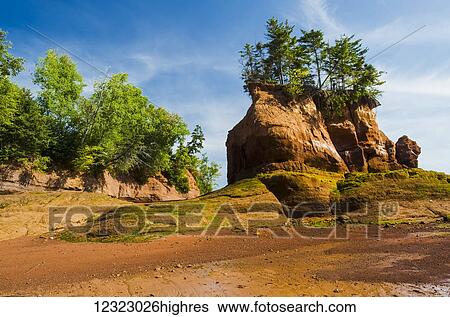 Outgoing tide and sandstone shoreline, near Lower Economy in the Minas Basin, Bay of Fundy; Nova Scotia, Canada View Large Photo Image Stock Photograph - Outgoing tide and sandstone shoreline, near Lower Economy in the Minas Basin, Bay of Fundy; Nova Scotia, Canada. Fotosearch