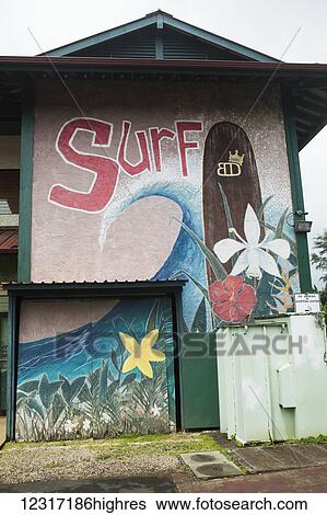 Stock Photograph - Painted wall sign outside a surf shop; Hanalei, Kauai, Hawaii, United States of America. Fotosearch