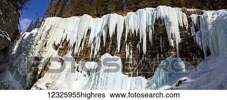 Panorama of large ice formations on rock cliff in Johnson Canyon; Alberta, Canada View Large Photo Image Stock Photograph - Panorama of large ice formations on rock cliff in Johnson Canyon; Alberta, Canada. Fotosearch