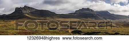 Stock Photograph - Panoramic view of the colourful tundra and mountains at the western tip of the Snaefellsness Peninsula; Iceland. Fotosearch