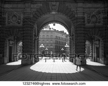 Pedestrians walking on the street and through and archway in old town, Gamla Stan; Stockholm, Sweden View Large Photo Image Stock Photograph - Pedestrians walking on the street and through and archway in old town, Gamla Stan; Stockholm, Sweden. Fotosearch