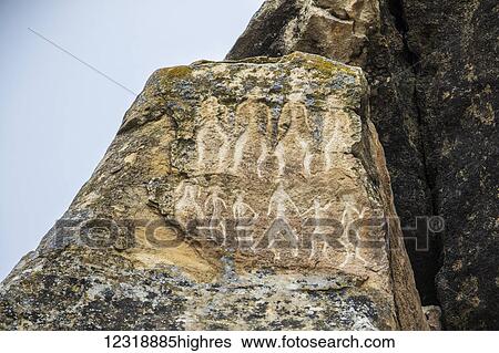 Stock Photograph - Petroglyphs depicting human figures dancing (Stone 0. 67 y), Beyukdesh Mountain, c. 6, 000 5, 000 BCE, Gobustan Rock Art Cultural Landscape; Gobustan, Azerbaijan. Fotosearch