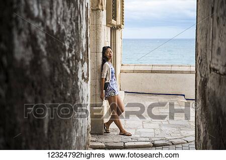 Portrait of a Chinese young woman in Maricel Palace; Sitges, Barcelona province, Spain View Large Photo Image Stock Photograph - Portrait of a Chinese young woman in Maricel Palace; Sitges, Barcelona province, Spain. Fotosearch