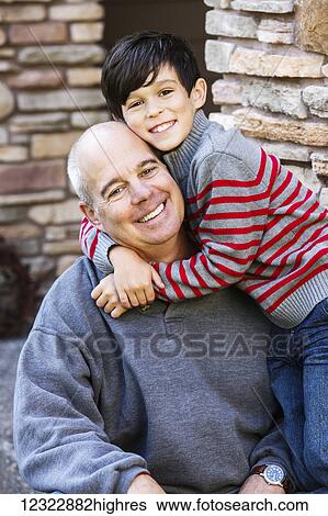 Stock Photograph - Portrait of a dad with his son; Oregon, United States of America. Fotosearch