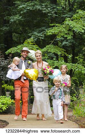 Portrait of a family dressed in formal wear walking down a paved trail in bare feet; Oregon, United States of America View Large Photo Image Stock Photograph - Portrait of a family dressed in formal wear walking down a paved trail in bare feet; Oregon, United States of America. Fotosearch