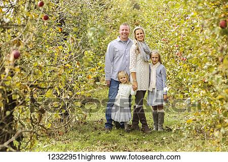 Stock Photograph - Portrait of a family with two daughters; Washington, United States of America. Fotosearch