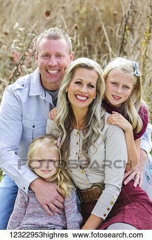 Portrait of a family with two daughters; Washington, United States of America View Large Photo Image Stock Photograph - Portrait of a family with two daughters; Washington, United States of America. Fotosearch