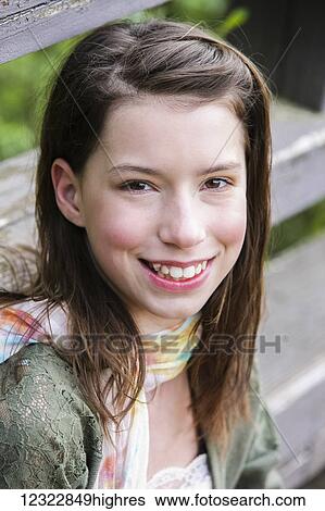 Stock Photograph - Portrait of a girl with brown hair and brown eyes; Washington, United States of America. Fotosearch