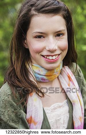 Stock Photograph - Portrait of a girl with brown hair and brown eyes; Washington, United States of America. Fotosearch