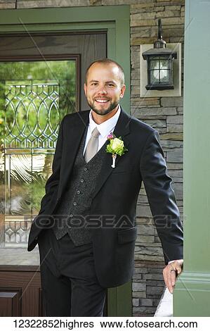Portrait of a man wearing a three piece suit and boutonniere; Oregon, United States of America View Large Photo Image Stock Photograph - Portrait of a man wearing a three piece suit and boutonniere; Oregon, United States of America. Fotosearch