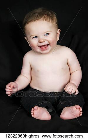 Portrait of a shirtless baby boy sitting against a black background; Oregon, United States of America View Large Photo Image Stock Photograph - Portrait of a shirtless baby boy sitting against a black background; Oregon, United States of America. Fotosearch