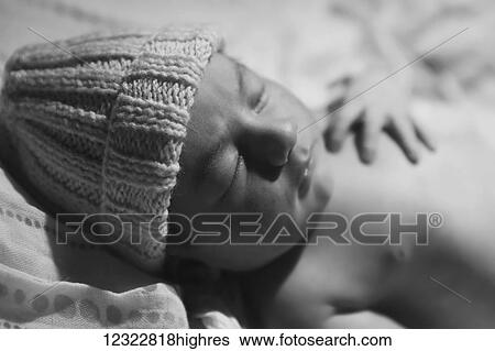 Portrait of a sleeping newborn baby wearing a knit hat; Oregon, United States of America View Large Photo Image Stock Photograph - Portrait of a sleeping newborn baby wearing a knit hat; Oregon, United States of America. Fotosearch