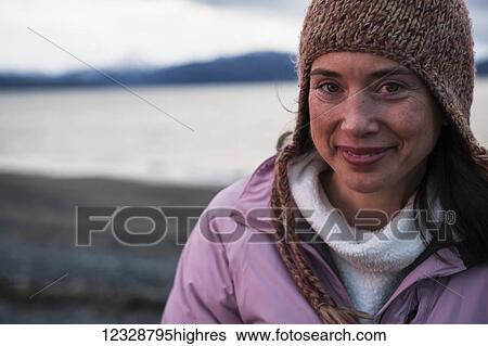 Portrait of a smiling woman wearing a knit hat; Homer, Alaska, United States of America View Large Photo Image Stock Photograph - Portrait of a smiling woman wearing a knit hat; Homer, Alaska, United States of America. Fotosearch