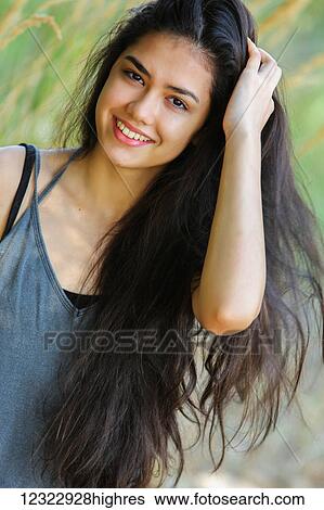 Portrait of a teenage girl with long, brown hair; Portland, Oregon, United States of America View Large Photo Image Stock Photograph - Portrait of a teenage girl with long, brown hair; Portland, Oregon, United States of America. Fotosearch
