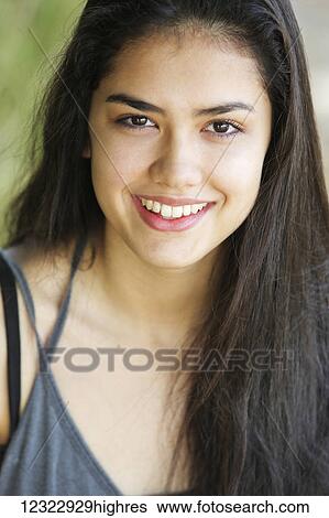 Stock Photograph - Portrait of a teenage girl with long, brown hair and brown eyes; Portland, Oregon, United States of America. Fotosearch