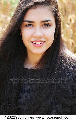 Portrait of a teenage girl with long, brown hair and brown eyes; Portland, Oregon, United States of America View Large Photo Image Stock Photograph - Portrait of a teenage girl with long, brown hair and brown eyes; Portland, Oregon, United States of America. Fotosearch