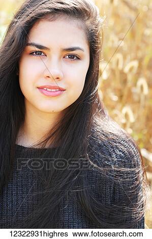 Stock Photograph - Portrait of a teenage girl with long, brown hair and brown eyes; Portland, Oregon, United States of America. Fotosearch