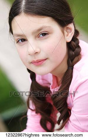 Portrait of a young girl with brunette hair in braids; Oregon, United States of America View Large Photo Image Stock Photograph - Portrait of a young girl with brunette hair in braids; Oregon, United States of America. Fotosearch