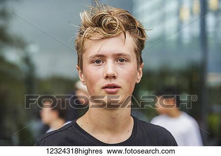 Stock Photograph - Portrait of a young man at Hanlan Boat Club; Ontario, Canada. Fotosearch