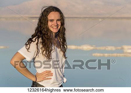 Portrait of a young woman standing with the Dead Sea in the background; South District, Israel View Large Photo Image Stock Photograph - Portrait of a young woman standing with the Dead Sea in the background; South District, Israel. Fotosearch