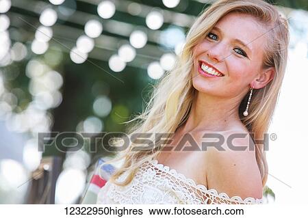 Portrait of a young woman with an off the shoulder lace shirt; Oregon, United States of America View Large Photo Image Stock Photograph - Portrait of a young woman with an off the shoulder lace shirt; Oregon, United States of America. Fotosearch
