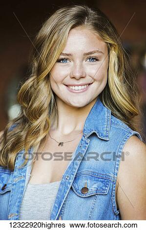 Stock Photograph - Portrait of a young woman with blond hair and blue eyes; Oregon, United States of America. Fotosearch