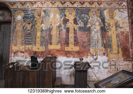Priest praying by the mural fresco on the 0rth wall of the Church of the Virgin, depicting Queen Rusudan, Prince Bagrat, King George II, Queen Helen, King Bagrat III of Imereti, Catholicos Yevclemon Chetidze and David the Builder, Gelati Monastery;... View Large Photo Image Stock Photograph - Priest praying by the mural fresco on the 0rth wall of the Church of the Virgin, depicting Queen Rusudan, Prince Bagrat, King George II, Queen Helen, King Bagrat III of Imereti, Catholicos Yevclemon Chetidze and David the Builder, Gelati Monastery;.... Fotosearch