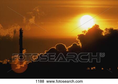 Processing plant at sunset with steam and smoke View Large Photo Image Stock Photo - Processing plant at sunset with steam and smoke. Fotosearch