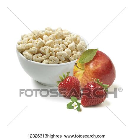 Stock Photograph - Puff snacks, strawberries and an apple on a white background. Fotosearch